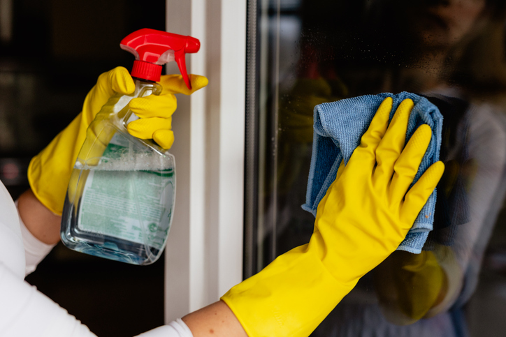 An expert wipes a window to share great commercial cleaning tips with everyone.